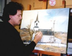 Gary P. Miller adding the details to a painting.